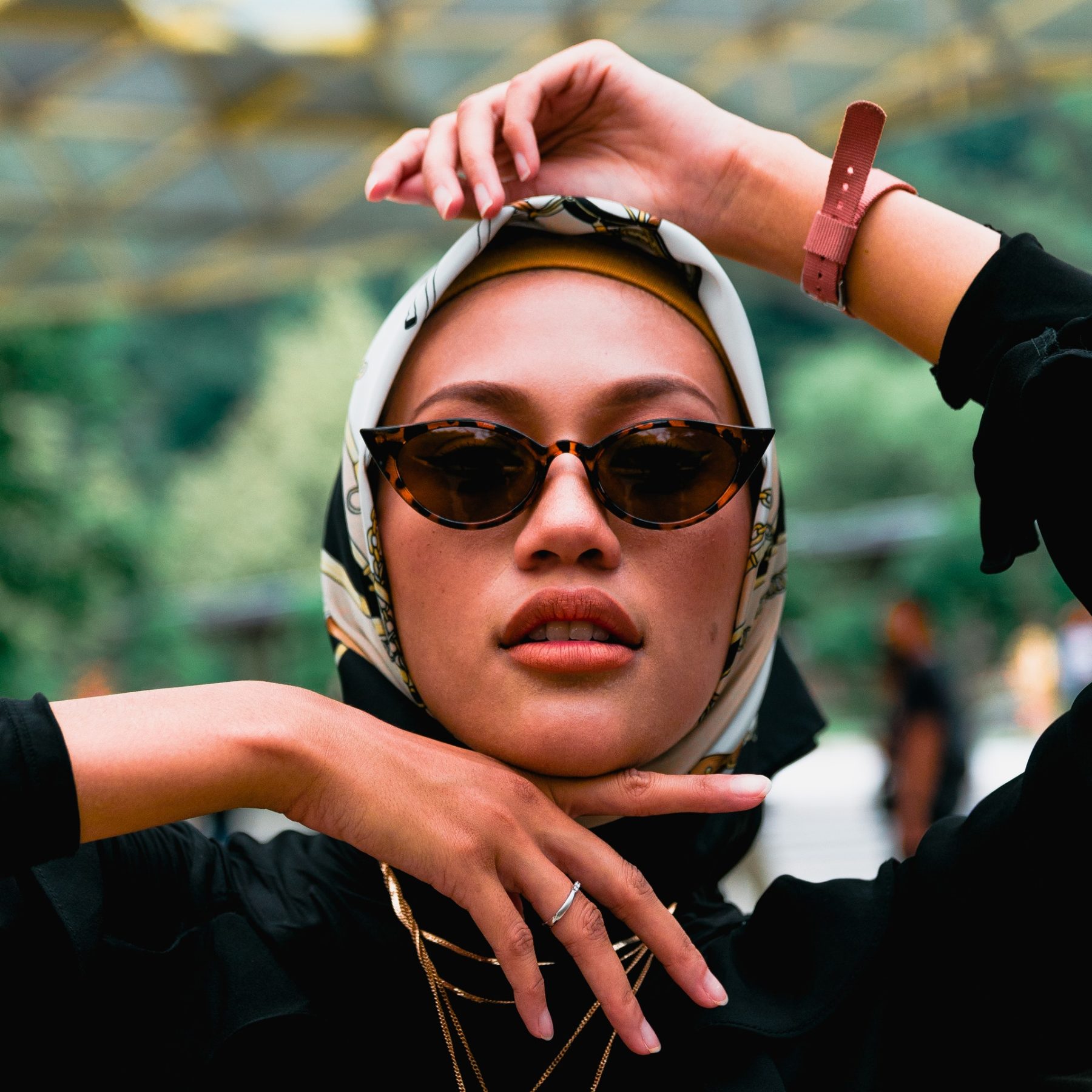 Woman in hijab wearing sunglasses